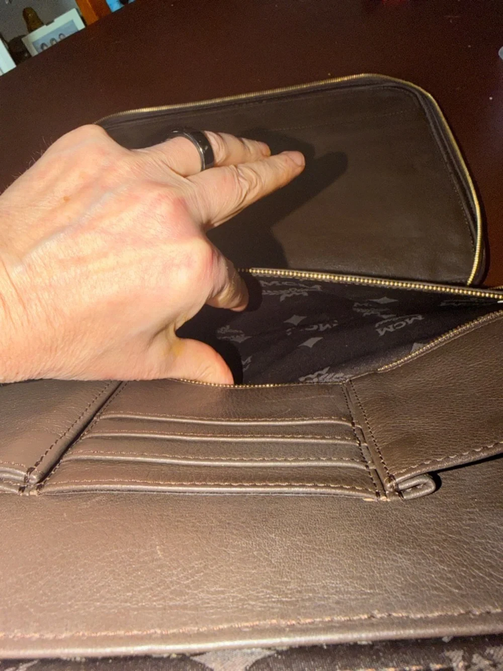 MCM laptop portfolio with brown leather trim and digital camo fabric